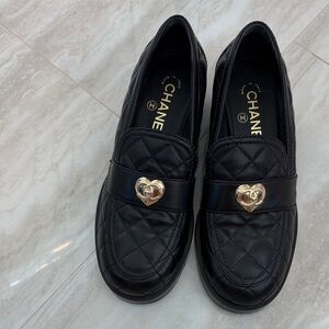 CHANEL Black Quilted Flats with Gold Heart Accent